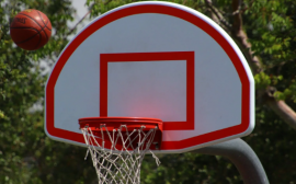 Portable basketball hoops near house